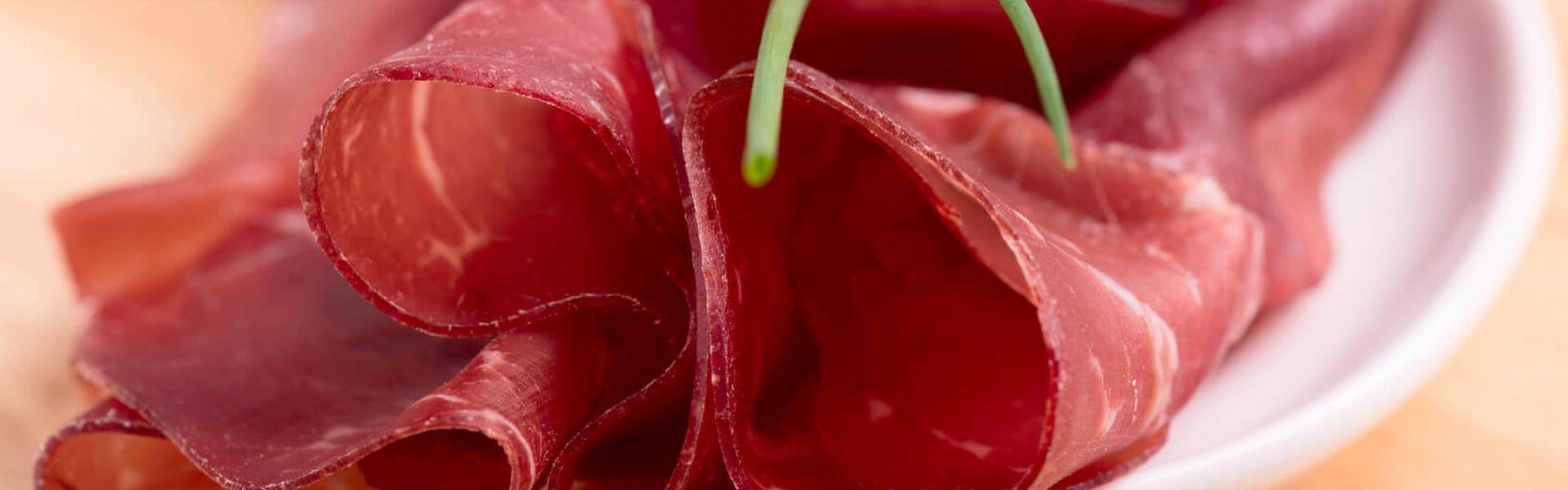 Bresaola della Valtellina Menatti come alimento della felicità